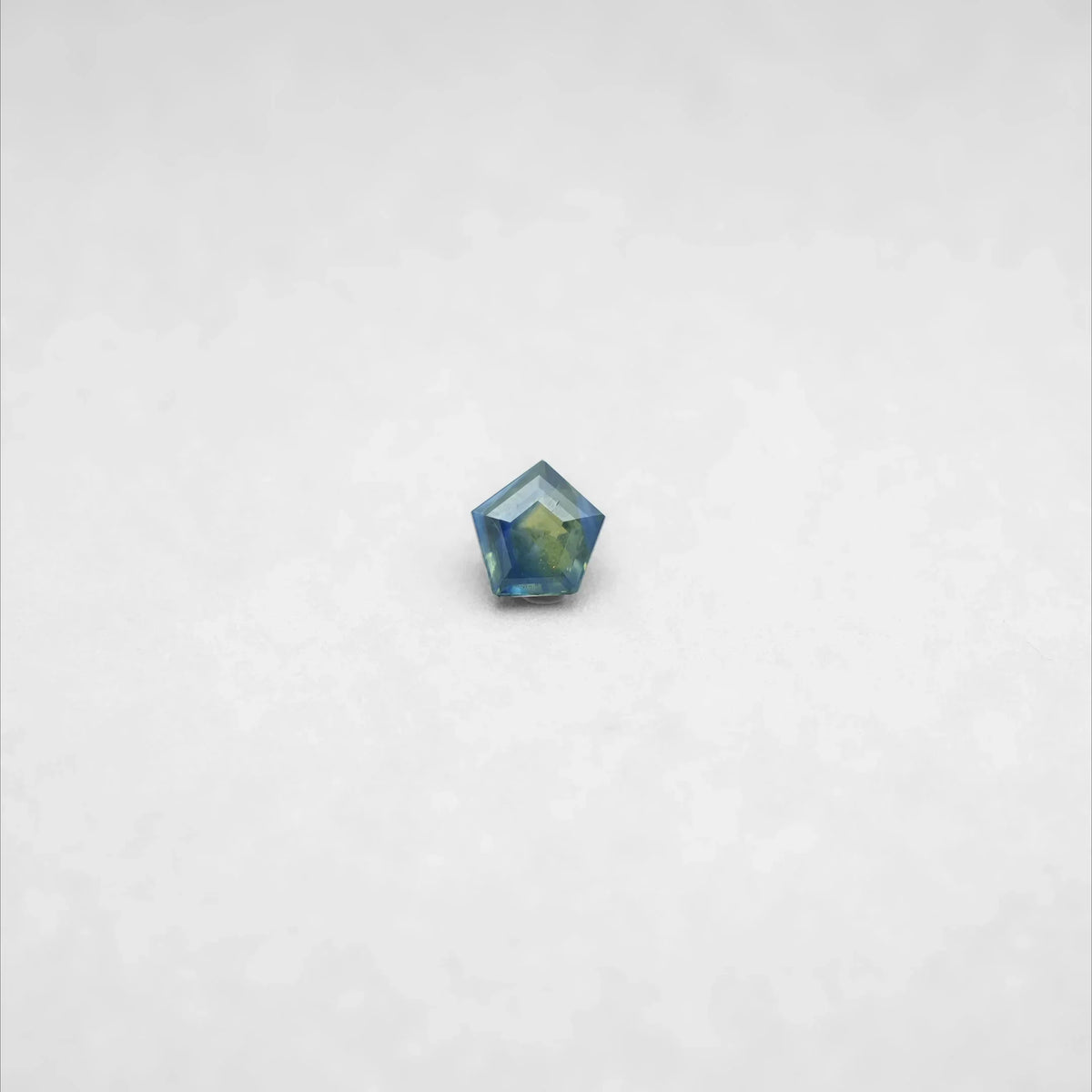 Faceted blue-green gemstone, ideal for elegant gold and diamond jewelry designs