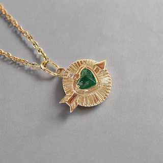 14k Gold Emerald Heart Pendant Shown With Chain From Side Angle  