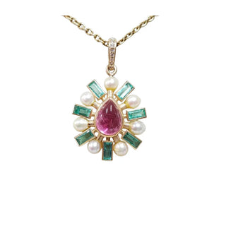 Elegant pendant with pink tourmaline, emerald, and pearl accents on gold chain