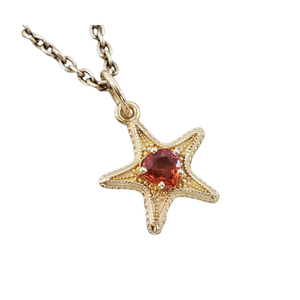 Pendentif cœur en or 14 carats et saphir orange : Bijou élégant en pierre précieuse
