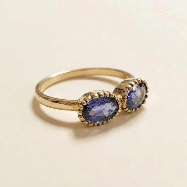 Bague en or 14 carats avec saphir orange et tanzanite