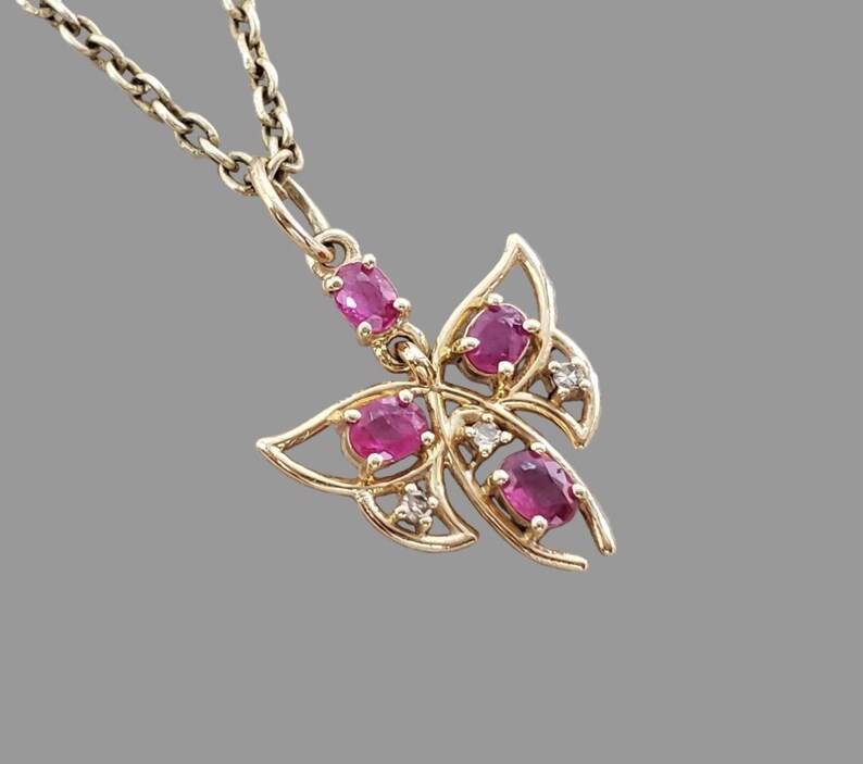 Ruby butterfly pendant with natural rubies in 14K gold wings