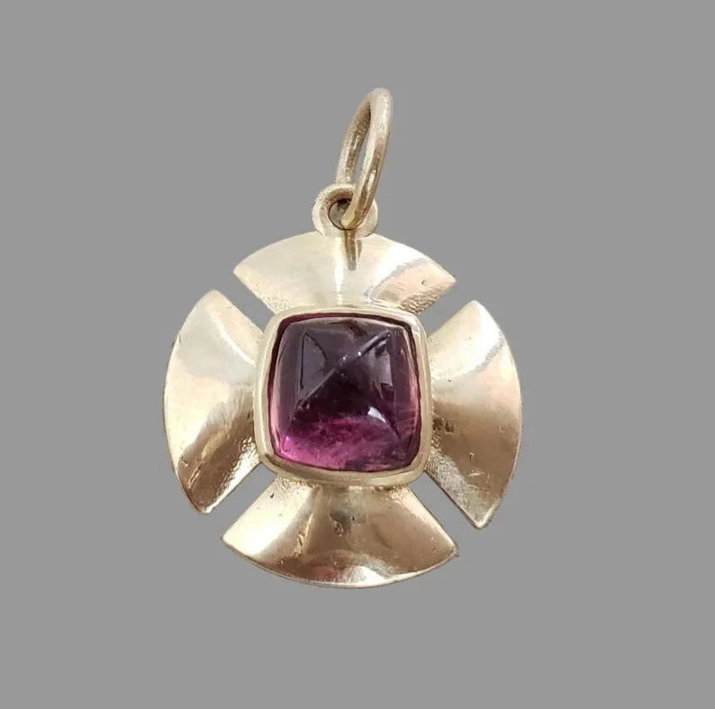 Gold pendant with purple gemstone, elegant cross design, luxury jewelry accessory