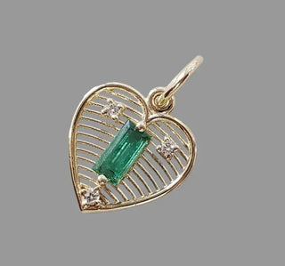 Gold heart pendant with emerald and diamond accents, elegant jewelry accessory