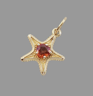 Pendentif cœur en or 14 carats et saphir orange : Bijou élégant en pierre précieuse