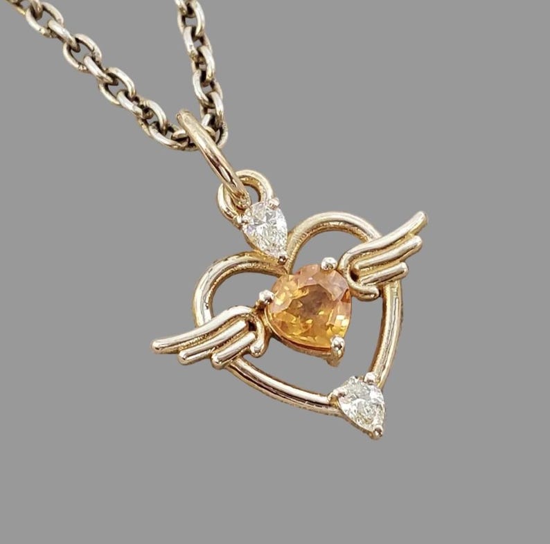Orange gemstone necklace charm with diamond frame