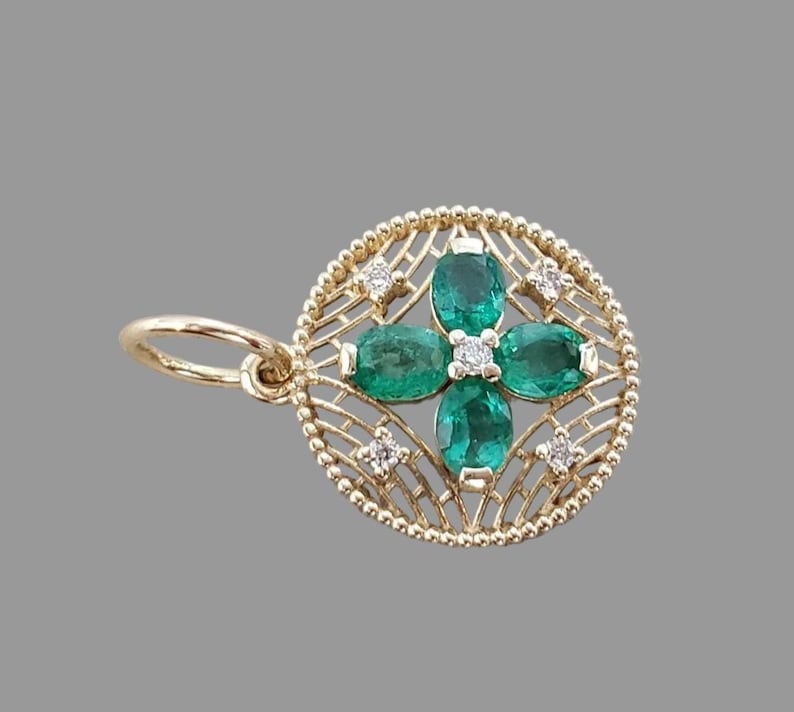 Emerald diamond pendant in floral filigree design