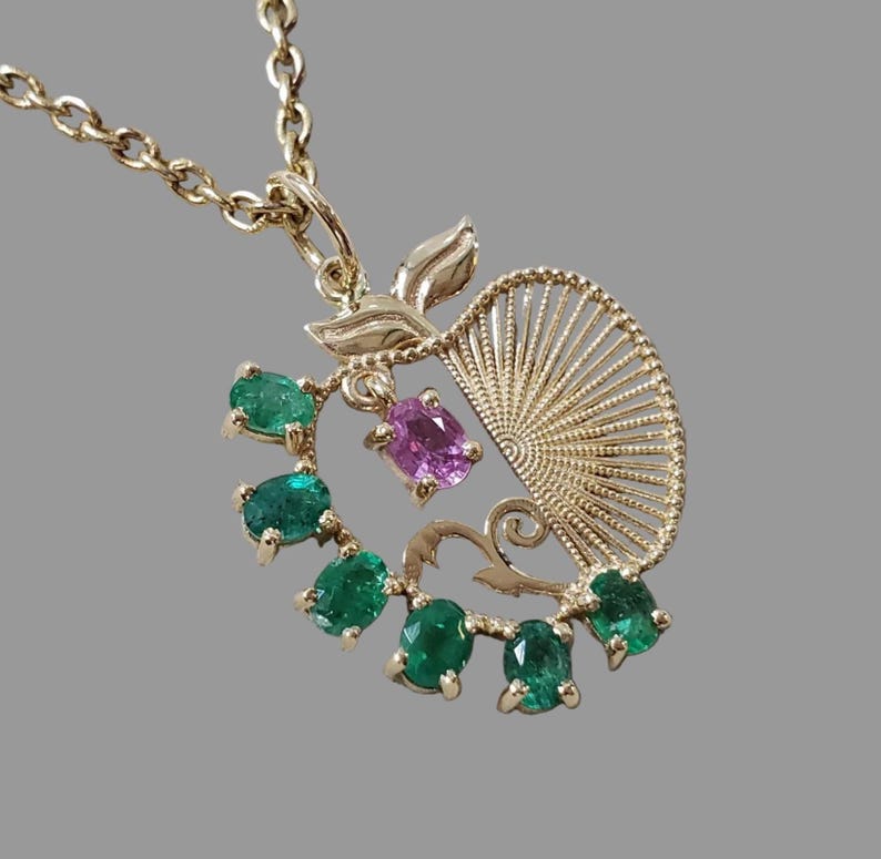 Pink sapphire pendant accent on a 14K gold apple