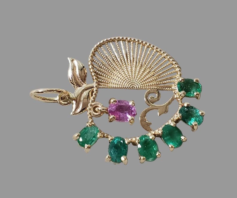 May birthstone pendant shaped like an apple, side view