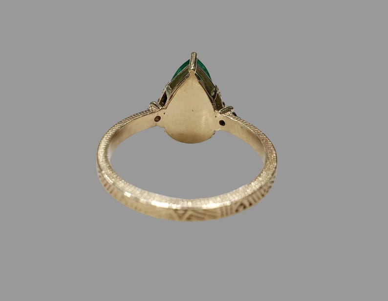 May birthstone ring with Zambian emerald, side view of textured band