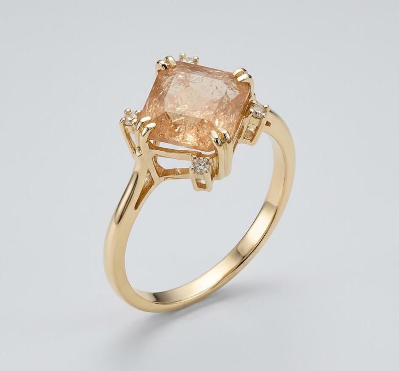 Handmade imperial topaz ring worn on the hand