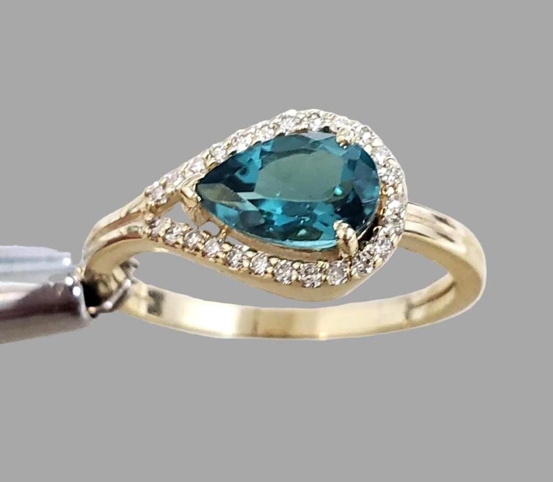 Handmade blue spinel halo ring in solid 14K gold, stackable band