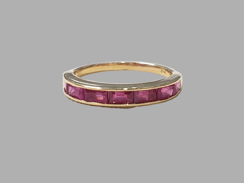 Ruby band ring with baguette rubies channel set in 14K gold