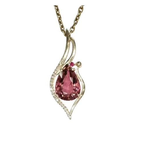 Elegant gold pendant with pear-shaped pink gemstone & diamond accents, perfect for luxury jewelry lovers