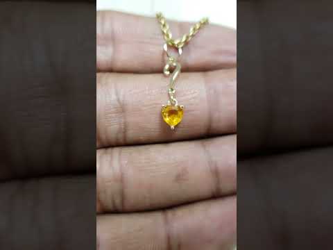 Pendentif cœur en or 14 carats et saphir orange : Bijou élégant en pierre précieuse