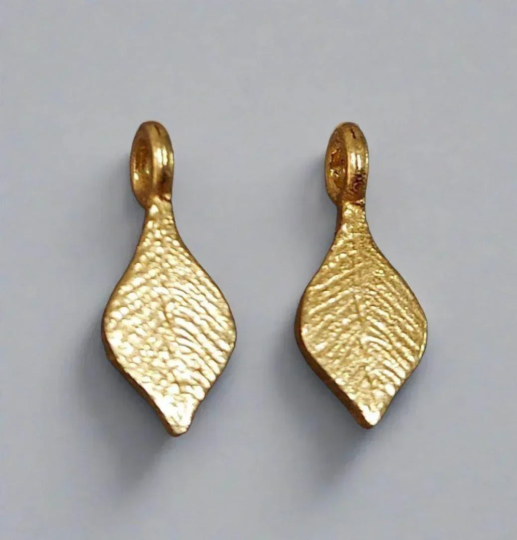 Textured gold leaf-shaped pendants with loop tops, elegant jewelry accessories
