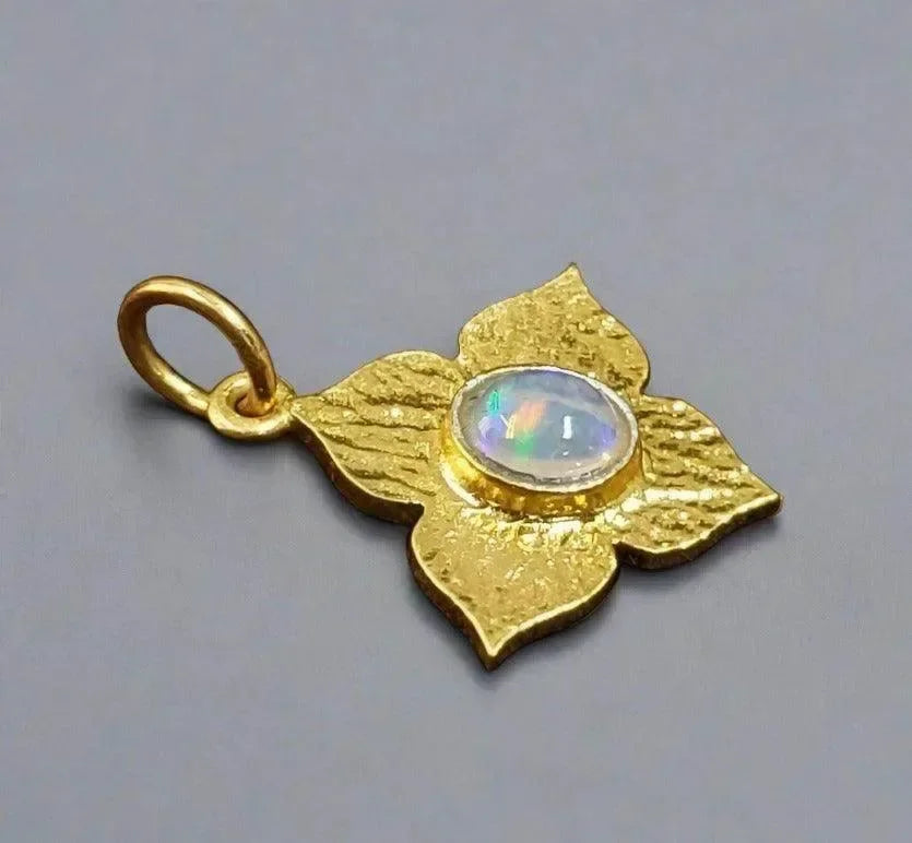 Gold flower pendant with opal center, elegant jewelry accessory