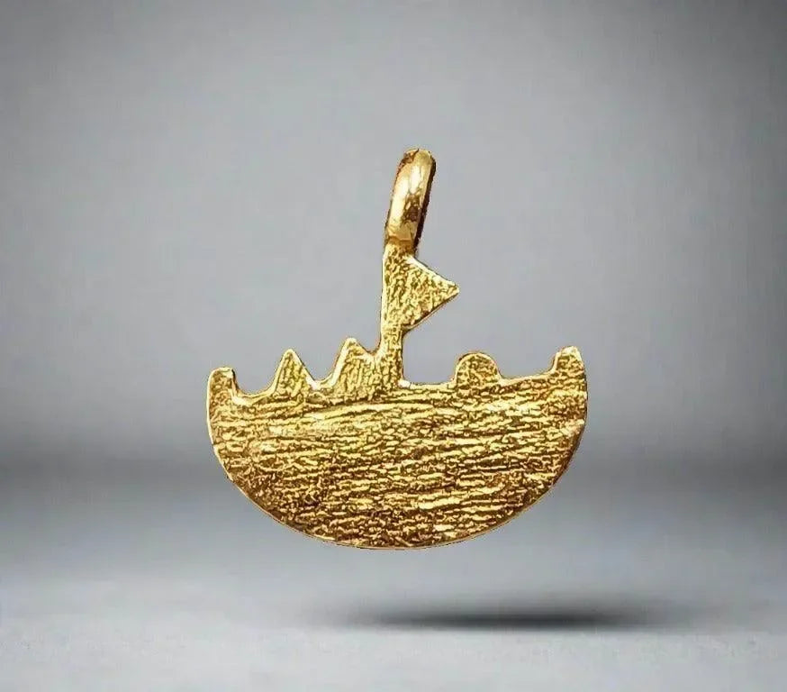 Gold boat pendant with textured surface, elegant nautical jewelry design