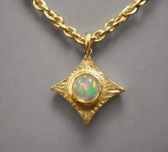Gold necklace with opal pendant, elegant diamond-shaped setting, luxury jewelry accessory