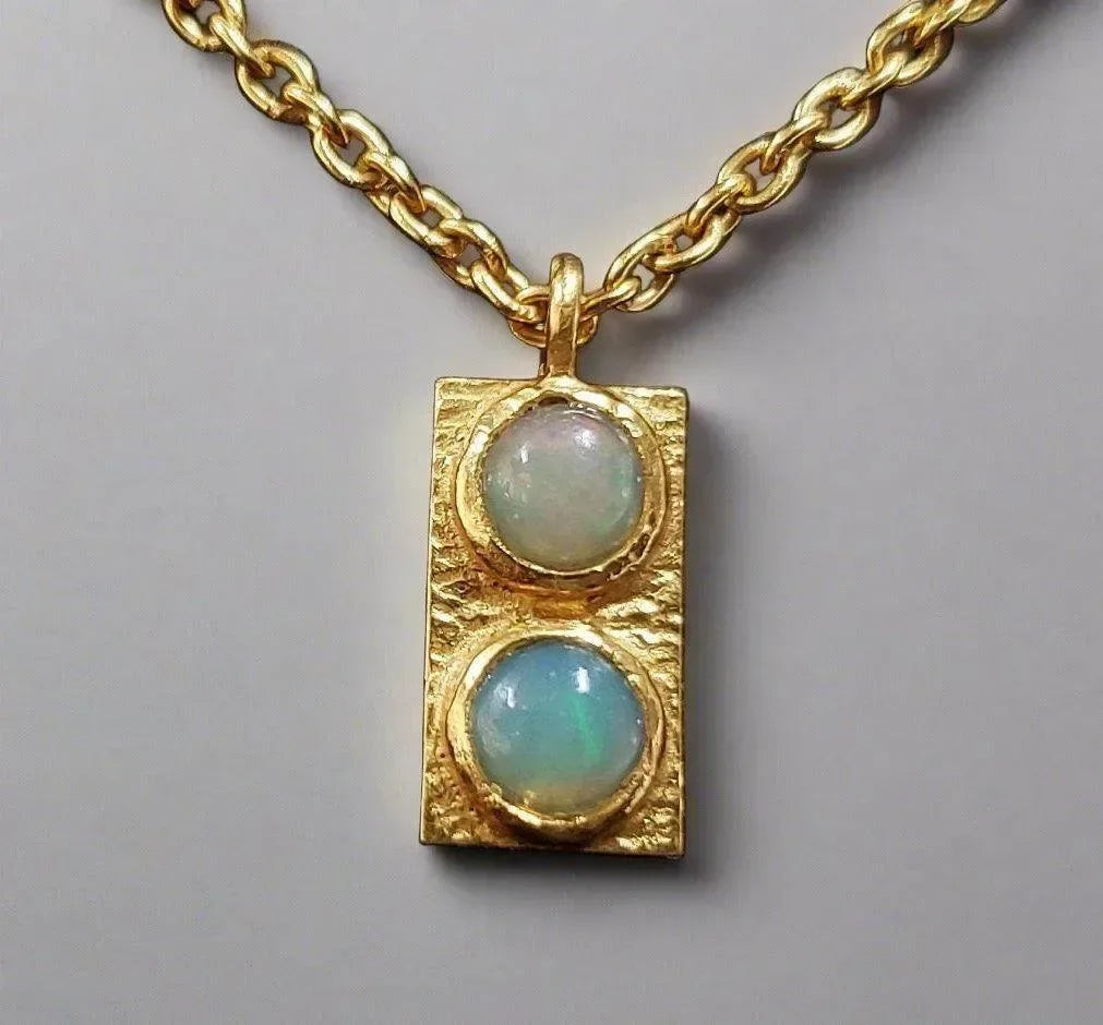 Gold necklace with dual opal pendant, elegant jewelry accessory