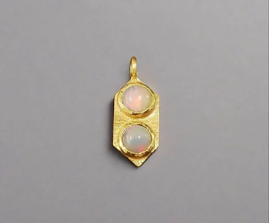 Gold pendant with two opal stones, elegant jewelry accessory