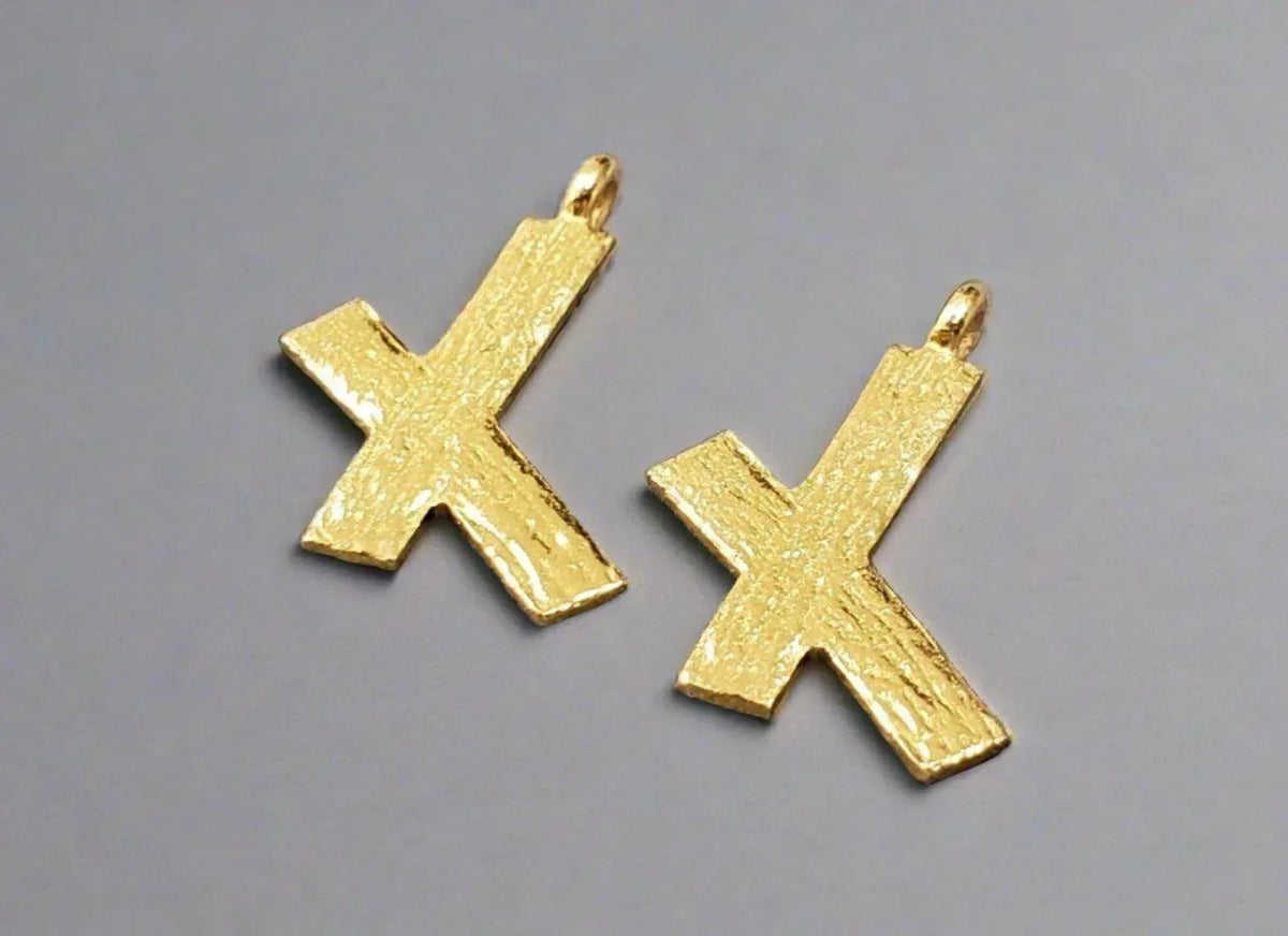 Gold cross pendants with textured finish, elegant jewelry accessories