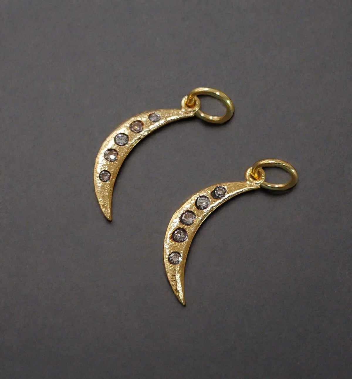 Gold crescent moon charms with diamond accents, elegant jewelry accessories