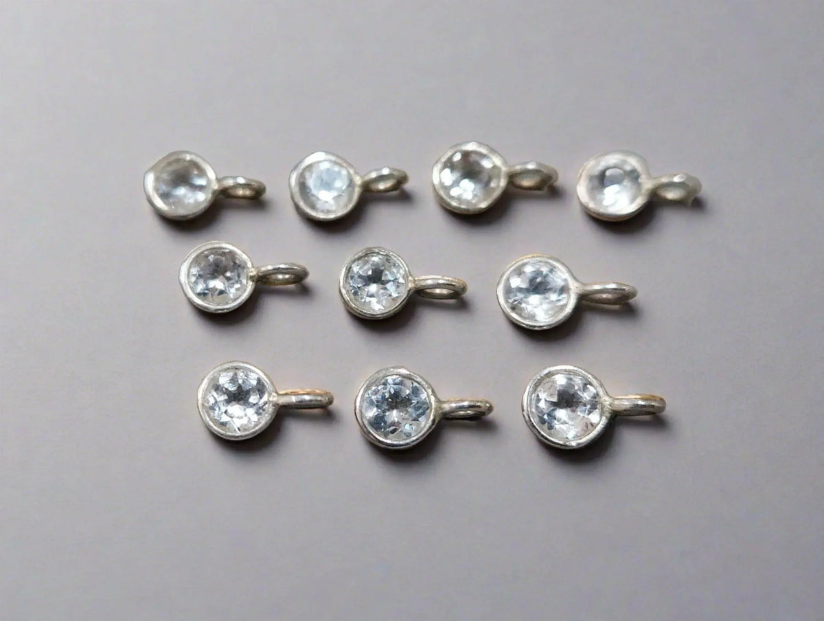 Elegant silver charms with clear gemstones, perfect for fine jewelry designs
