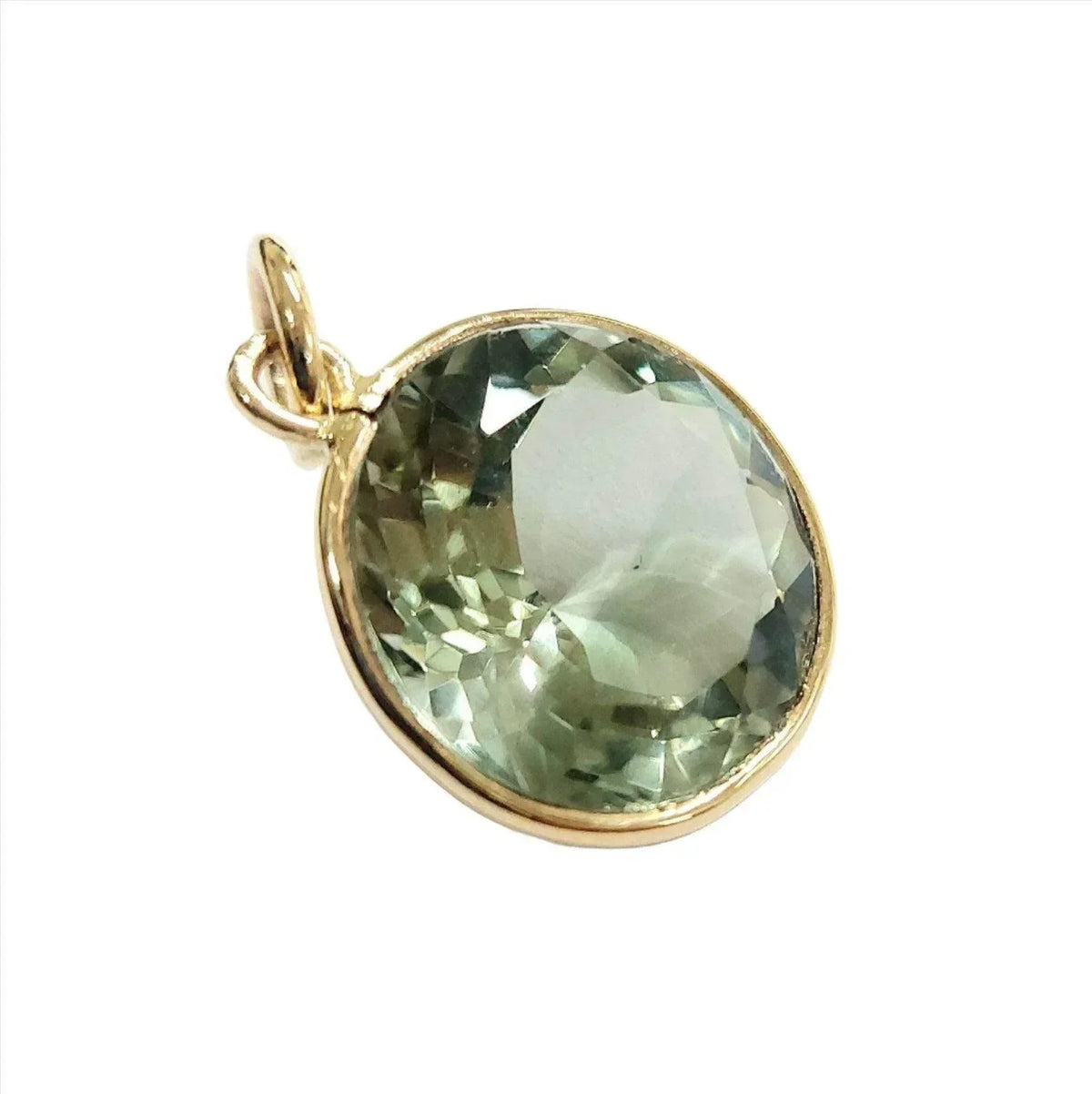 Faceted green gemstone pendant in gold setting, elegant jewelry accessory