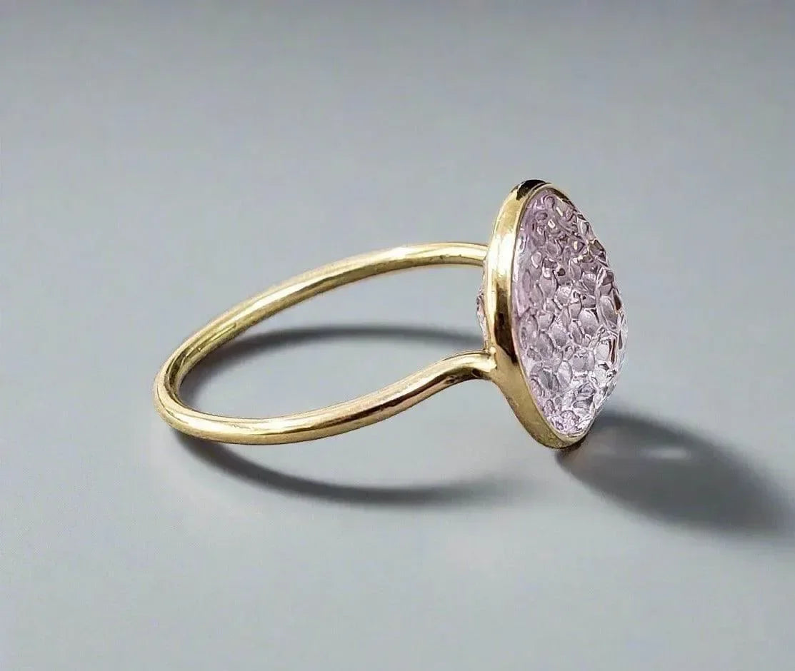 Elegant gold ring with pink druzy gemstone, perfect for sophisticated jewelry lovers