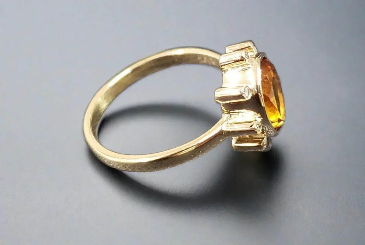 Gold ring with oval citrine gemstone, elegant jewelry accessory