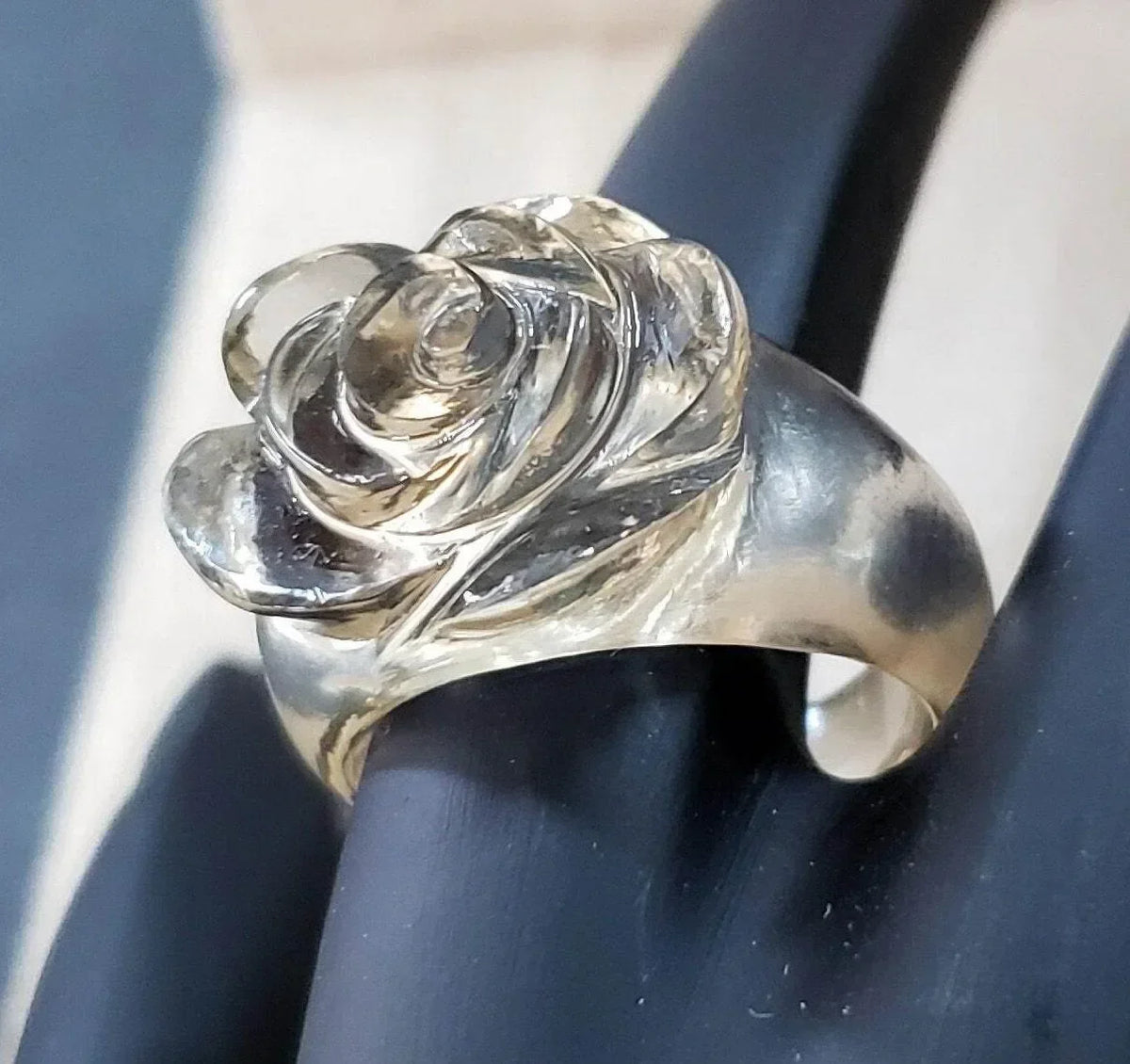 Elegant rose flower ring in silver, showcasing intricate petal details and polished finish for sophisticated jewelry lovers.